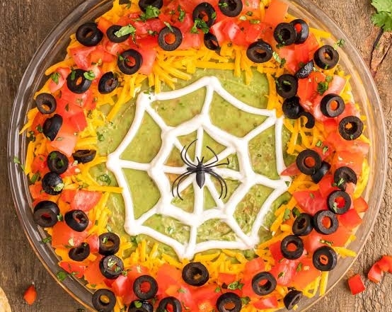 The Best Spiderweb Taco Dip Recipe Ever suggested serving